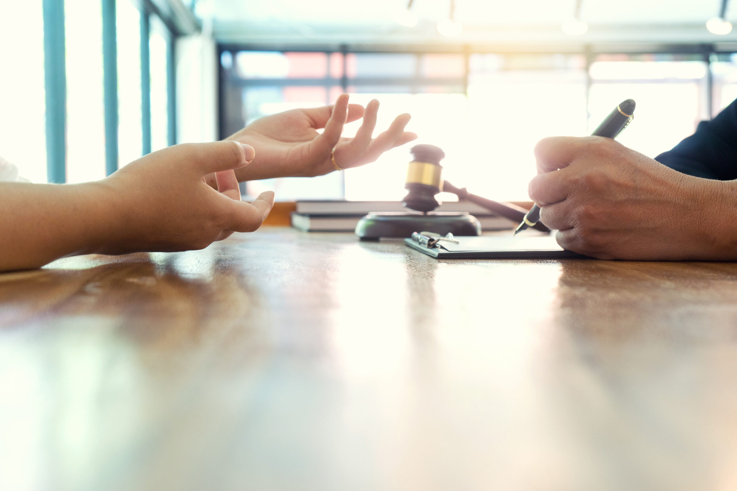 Business professionals discussing litigation strategy in conference room